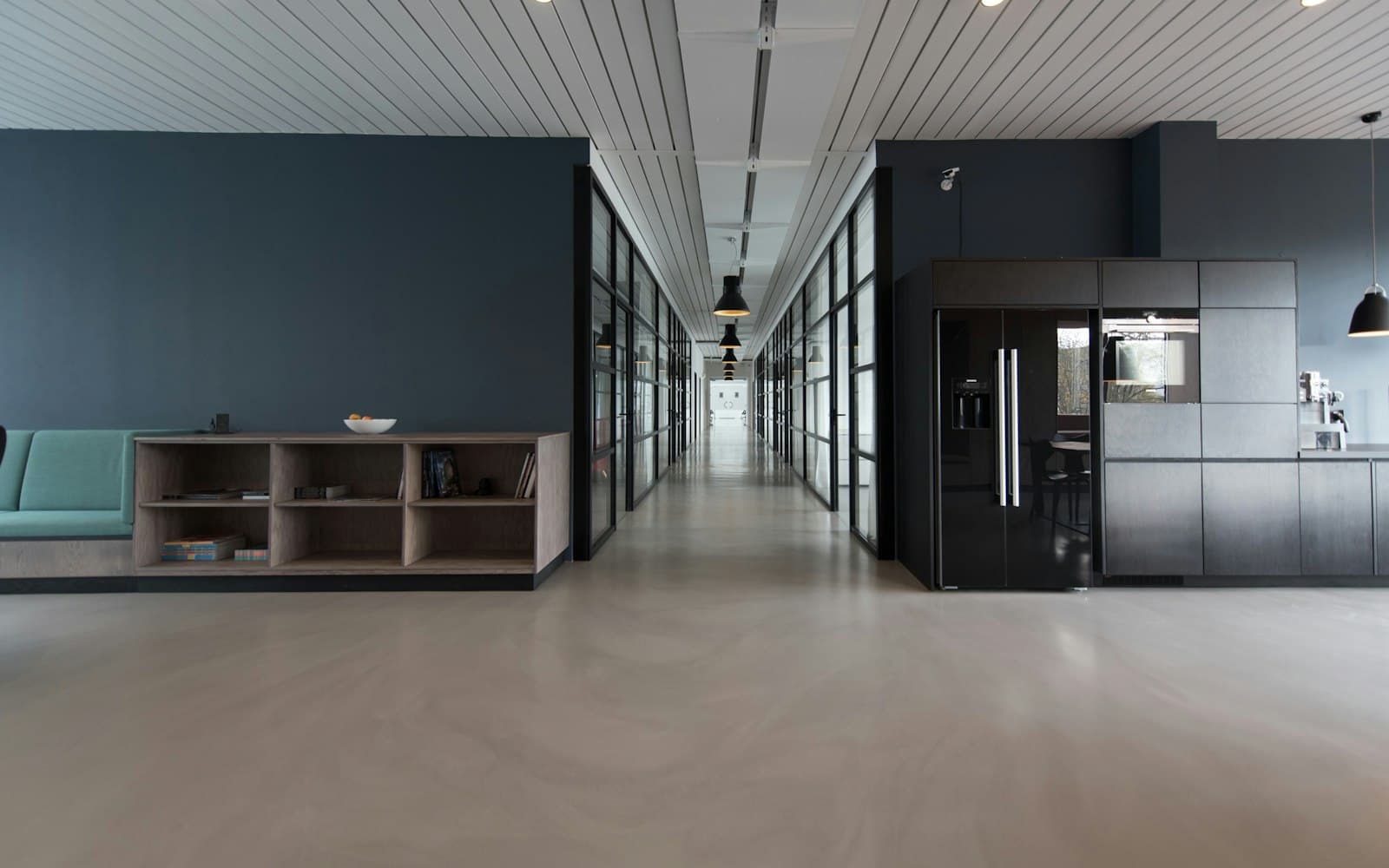 Long open-plan space with polished concrete floors